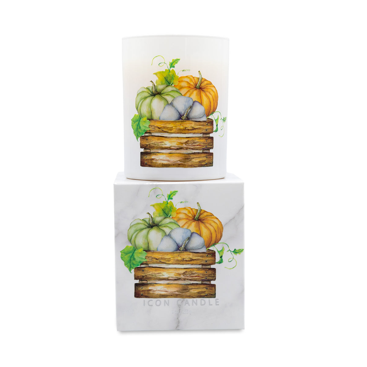 A white square candle box with a marble-like texture featuring an illustration of pumpkins in a wooden crate, with a matching white cylindrical candle displayed on top against a plain white background.