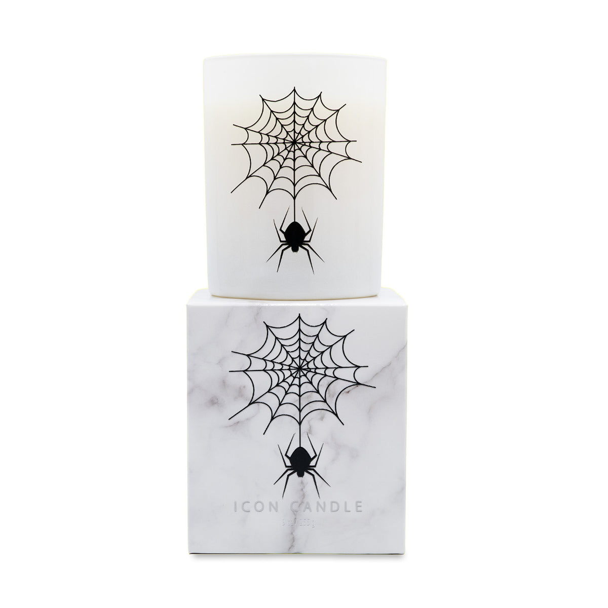 A white glass jar candle with a black spider and cobweb graphic, displayed on top of its matching white marble-patterned box. The box features the brand name 'ICON CANDLE' at the bottom.