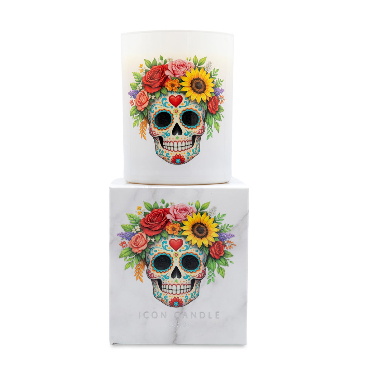 A white glass candle jar with a colorful sugar skull and floral design, shown with its white marble-patterned box labeled 'ICON CANDLE' on a white background.