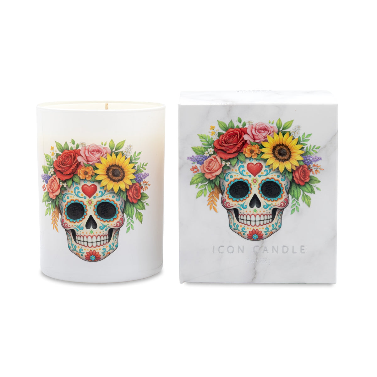 A white candle in a white glass vessel with a colorful sugar skull and floral print, shown next to its white marble-patterned packaging box featuring the same design and the text 'ICON CANDLE'.
