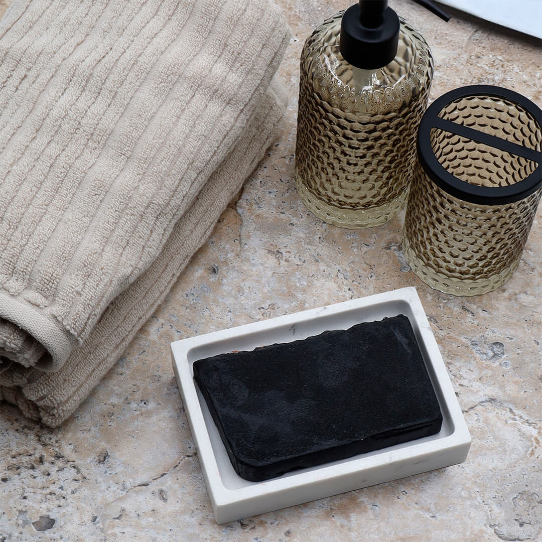 Bamboo Charcoal glycerin bar soap, a jet-black rectangular bar topped with Himalayan pink salt crystals.
