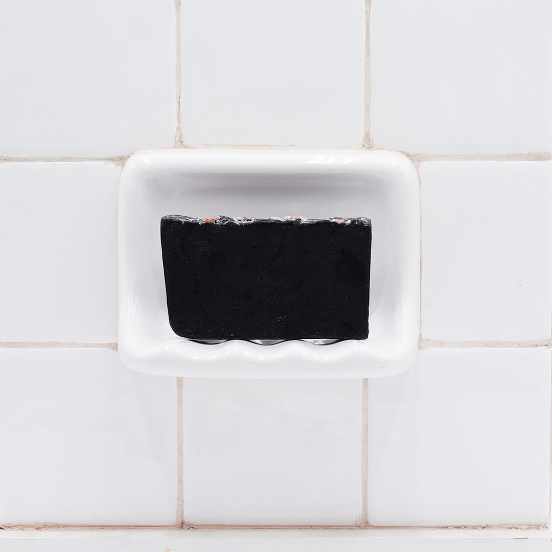 Bamboo Charcoal glycerin bar soap, a jet-black rectangular bar topped with Himalayan pink salt crystals.