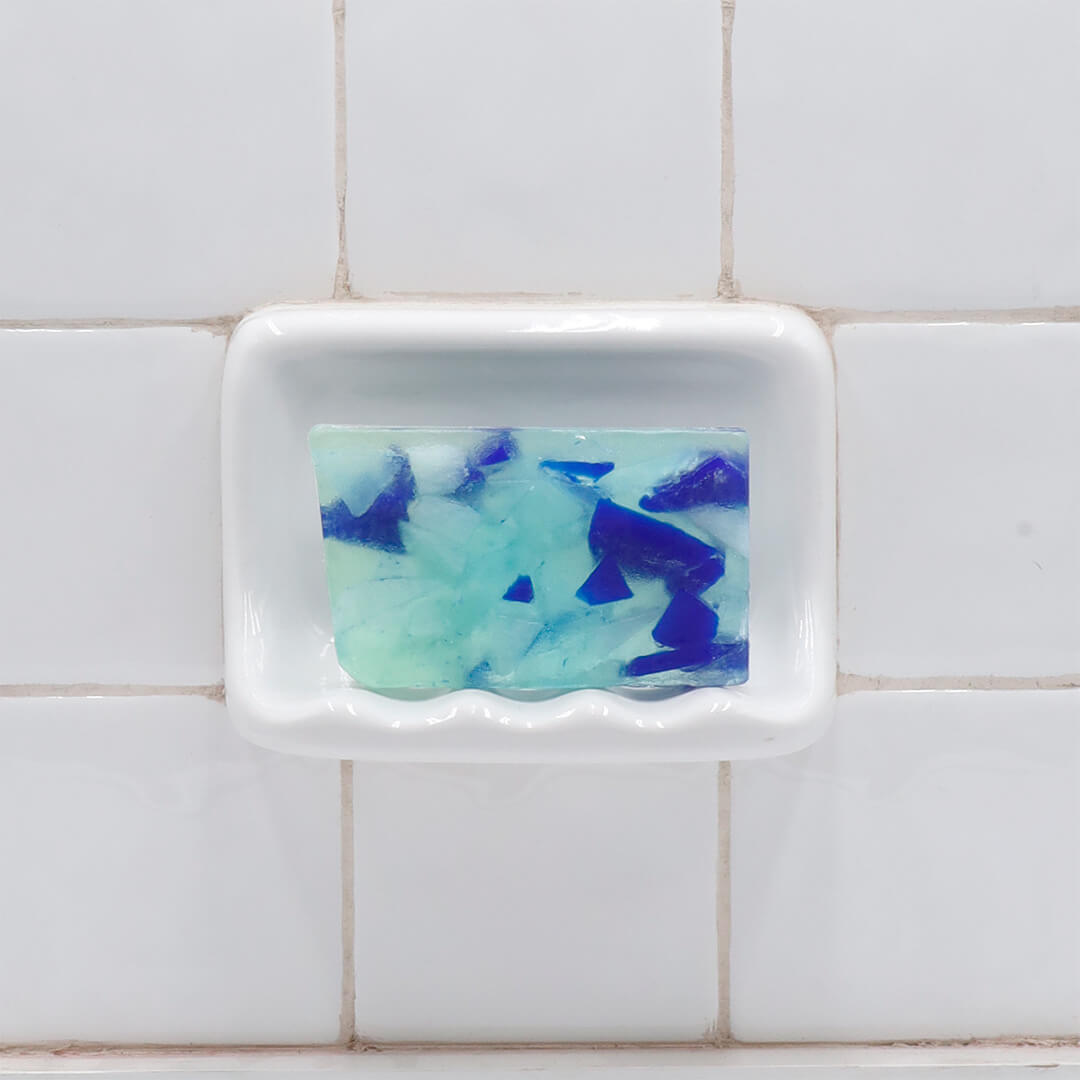 Beach Glass glycerin bar soap with blue, aqua, and pale green sea glass-inspired soap pieces in a translucent rectangular bar.