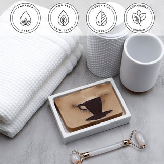 Café Au Lait Vegetable Glycerin Bar Soap in a white dish on a stone surface.