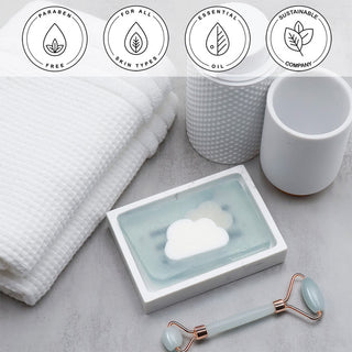 Clouds Vegetable Glycerin Bar Soap in a white dish on a stone surface.