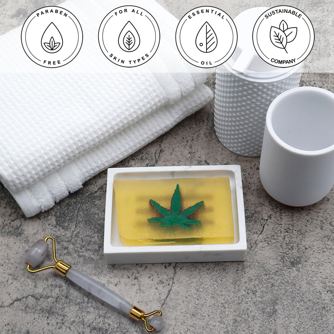 Pot Leaf Vegetable Glycerin Bar Soap in a white dish on a stone surface.