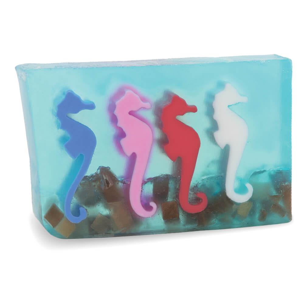 A Day at the Races aqua glycerin bar soap with colorful blue, pink, red, and white seahorses suspended in a translucent ocean-inspired design