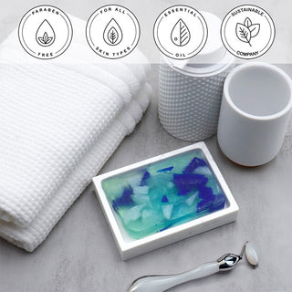 Beach Glass Vegetable Glycerin Bar Soap in a white dish on a stone surface.