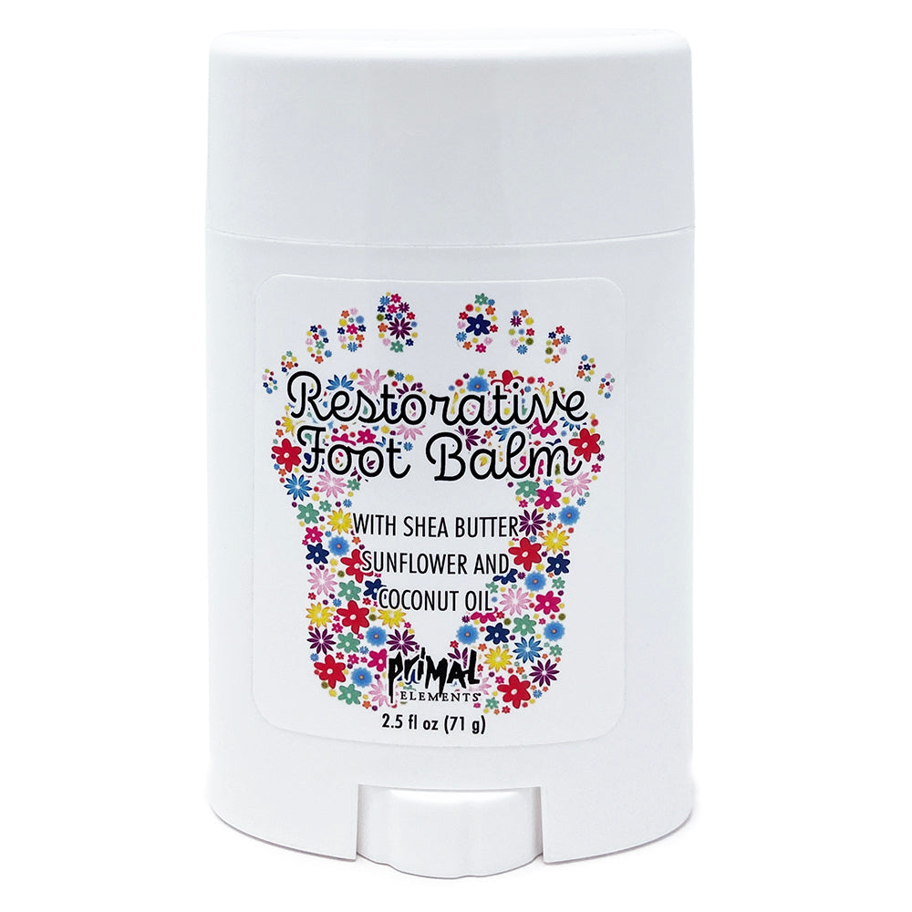 A white plastic deodorant-style container of Primal Elements Restorative Foot Balm with a colorful floral footprint graphic and text on the front, shown on a plain white background.