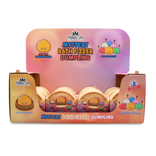 Primal Spa Mystery Bath Fizzer Dumpling retail display box containing six small round dumpling-shaped items, with a pastel gradient backing card and branded packaging.
