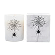 A white candle in a frosted glass jar with a black spider and web graphic, shown next to its white marble-patterned box featuring the same design and the text 'ICON CANDLE'.