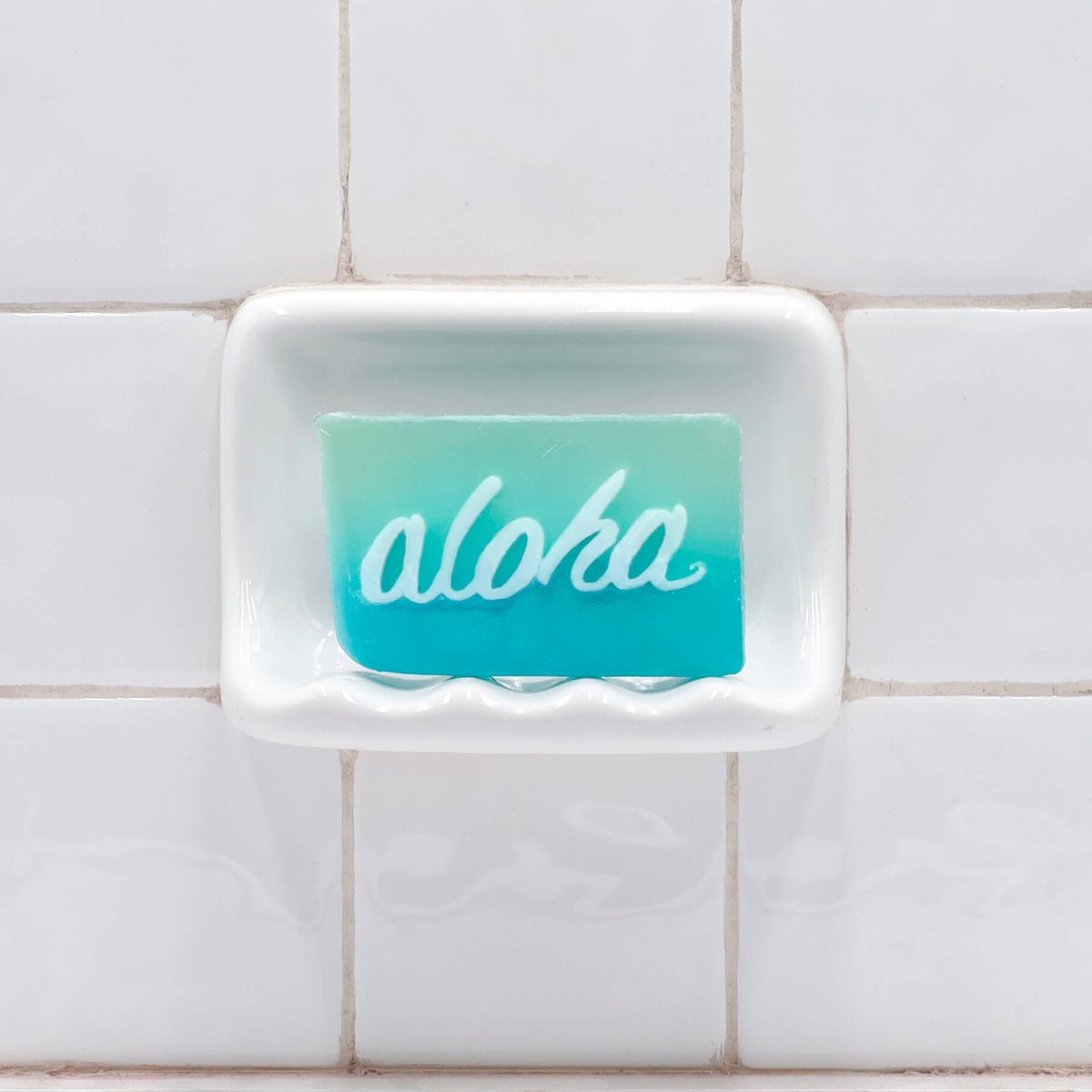 Aloha Glycerin Bar Soap featuring a two-tone aqua and turquoise blue design with the word aloha in white script