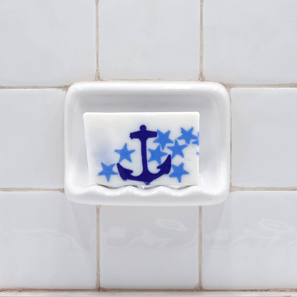 Image Alt Text
White glycerin bar soap featuring a navy blue anchor surrounded by light blue stars.