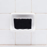 Bamboo Charcoal glycerin bar soap, a jet-black rectangular bar topped with Himalayan pink salt crystals.