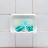 Blue Margarita glycerin bar soap featuring a blue margarita glass, green lime garnish, and teal and white soap pieces in a translucent bar.