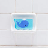 Blue Whale glycerin bar soap featuring a blue whale with a black eye and white waterspout in a translucent turquoise rectangular bar.