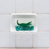 Alligator glycerin bar soap featuring a green alligator suspended in clear soap above textured green swamp-inspired details