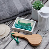 Alligator glycerin bar soap featuring a green alligator suspended in clear soap above textured green swamp-inspired details