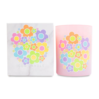 Pink candle with colorful floral design and matching white box on a white background