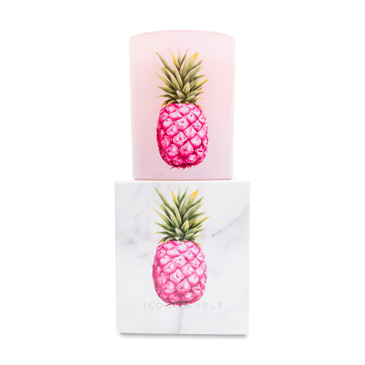 Pink pineapple candle on top of matching white box on a white background