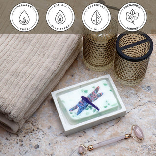 Dragonfly Vegetable Glycerin Bar Soap in a white dish on a stone surface.