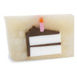 Birthday Cake glycerin bar soap featuring a white and brown layer cake slice topped with a pink candle and orange flame.