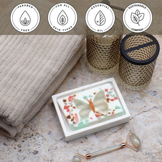 Butterfly Vegetable Glycerin Bar Soap in a white dish on a stone surface.