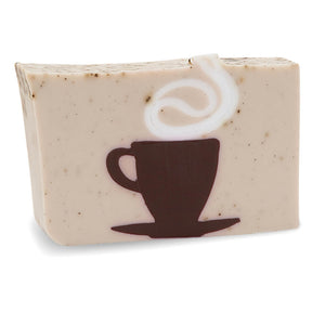 Café Au Lait glycerin bar soap with coffee ground speckles and a brown coffee cup and saucer topped by a white steam swirl.