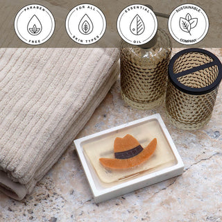 Cowboy Hat Vegetable Glycerin Bar Soap in a white dish on a stone surface.