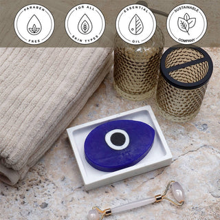 Evil Eye Vegetable Glycerin Bar Soap in a white dish on a stone surface.