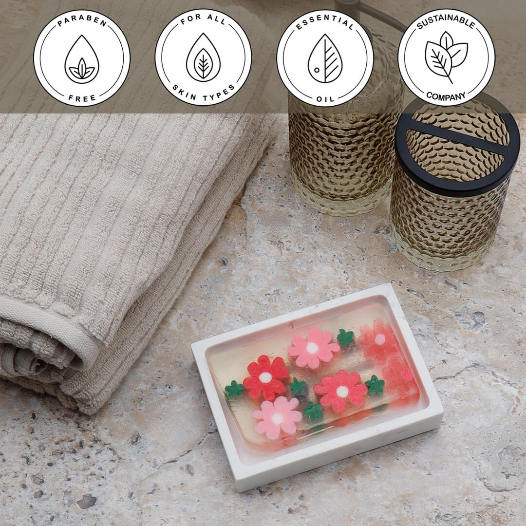 Flowershop Vegetable Glycerin Bar Soap in a white dish on a stone surface.