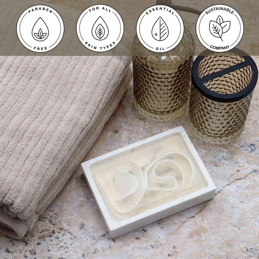 Gardenia Vegetable Glycerin Bar Soap in a white dish on a stone surface.