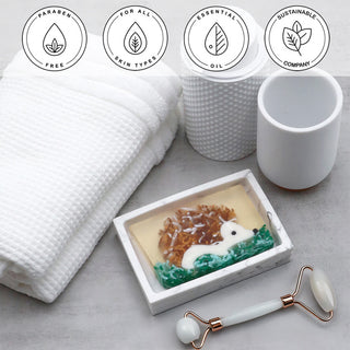 Hedgehog Vegetable Glycerin Bar Soap in a white dish on a stone surface.