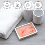 Himalayan Pink Sea Salt Vegetable Glycerin Bar Soap in a white dish on a stone surface.