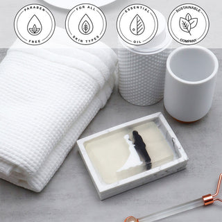 Holy Matrimony Vegetable Glycerin Bar Soap in a white dish on a stone surface.