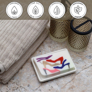 Imelda Vegetable Glycerin Bar Soap in a white dish on a stone surface.