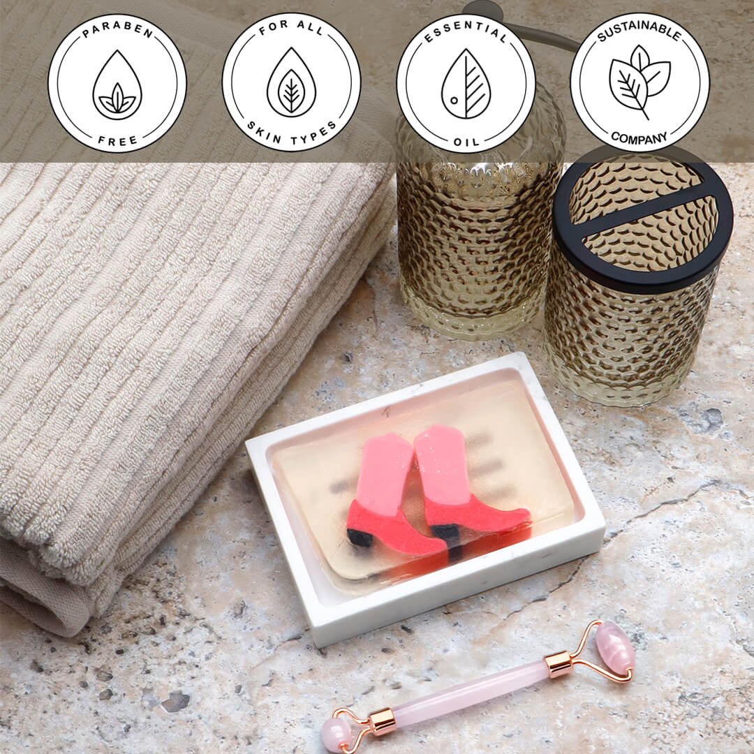 Pink Boots Vegetable Glycerin Bar Soap in a white dish on a stone surface.