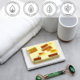 Tahitian Vanilla Vegetable Glycerin Bar Soap in a white dish on a stone surface.