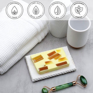 Tahitian Vanilla Vegetable Glycerin Bar Soap in a white dish on a stone surface.