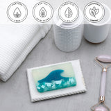 Tranquility Vegetable Glycerin Bar Soap in a white dish on a stone surface.