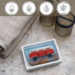 Wanderlust Vegetable Glycerin Bar Soap in a white dish on a stone surface.