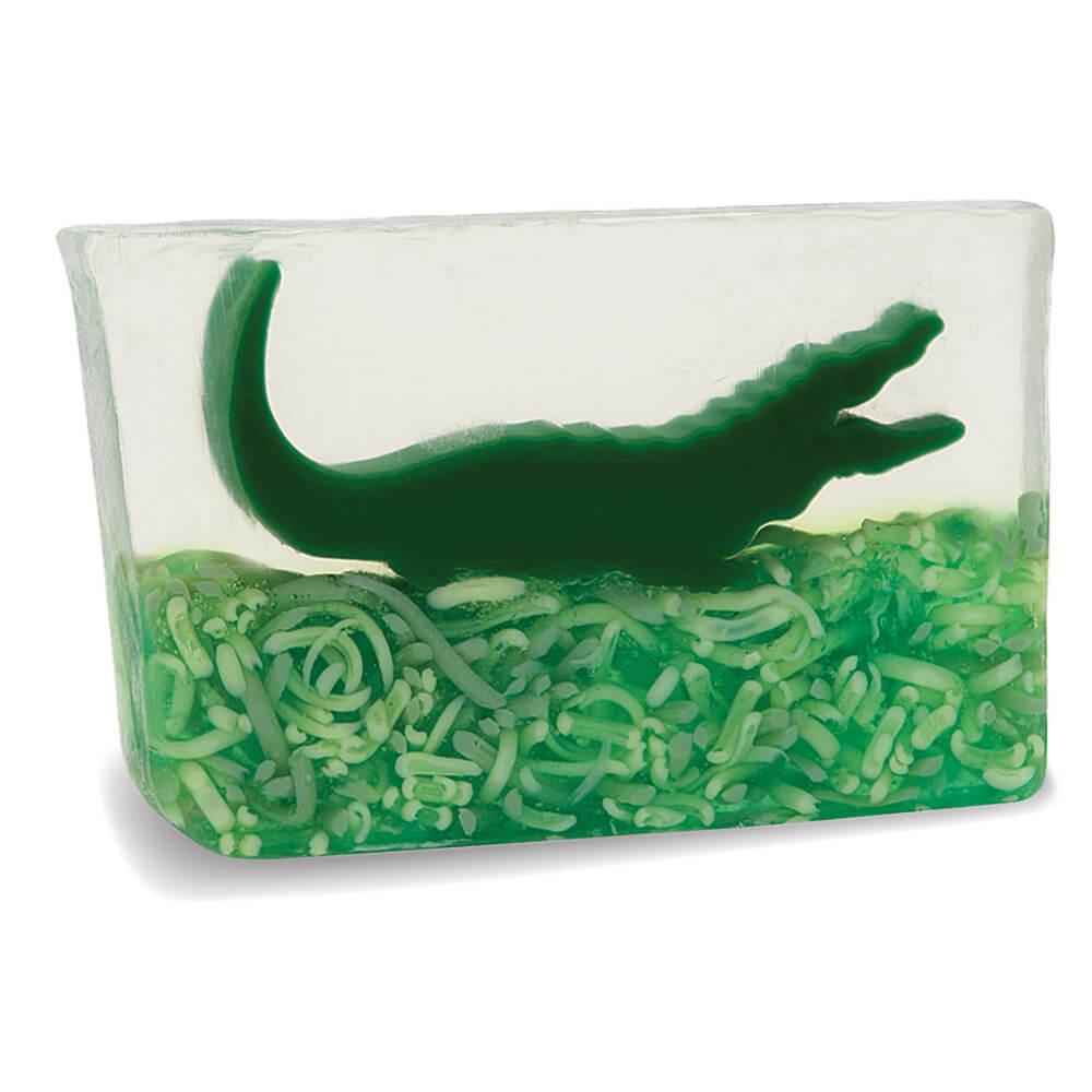 Alligator glycerin bar soap featuring a green alligator suspended in clear soap above textured green swamp-inspired details